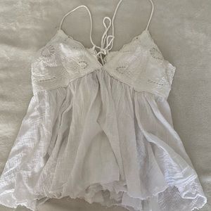 White tie back peplum top with lace appliqué